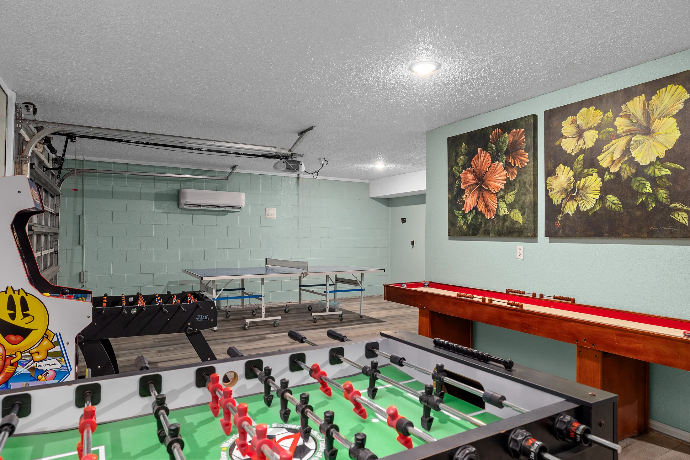 Game room with ping-pong, foosball and arcade entertainment