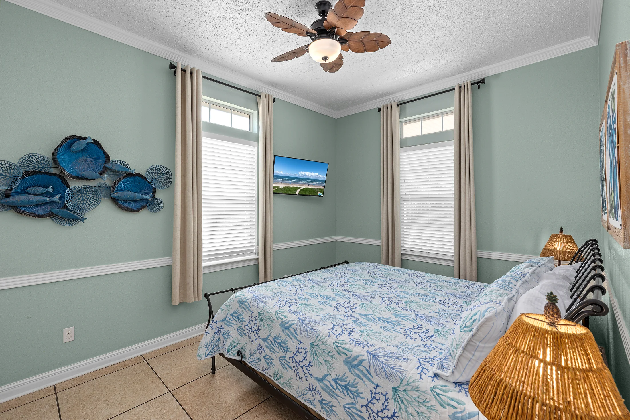 Bedroom 2 at Beach Breeze SPI with a king bed and coastal blue decor